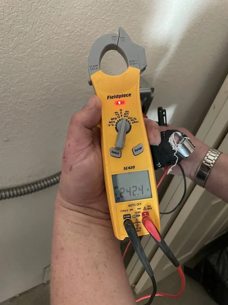 Voltage testing with clamp meter during Ceiling Fan Installation in Duvall